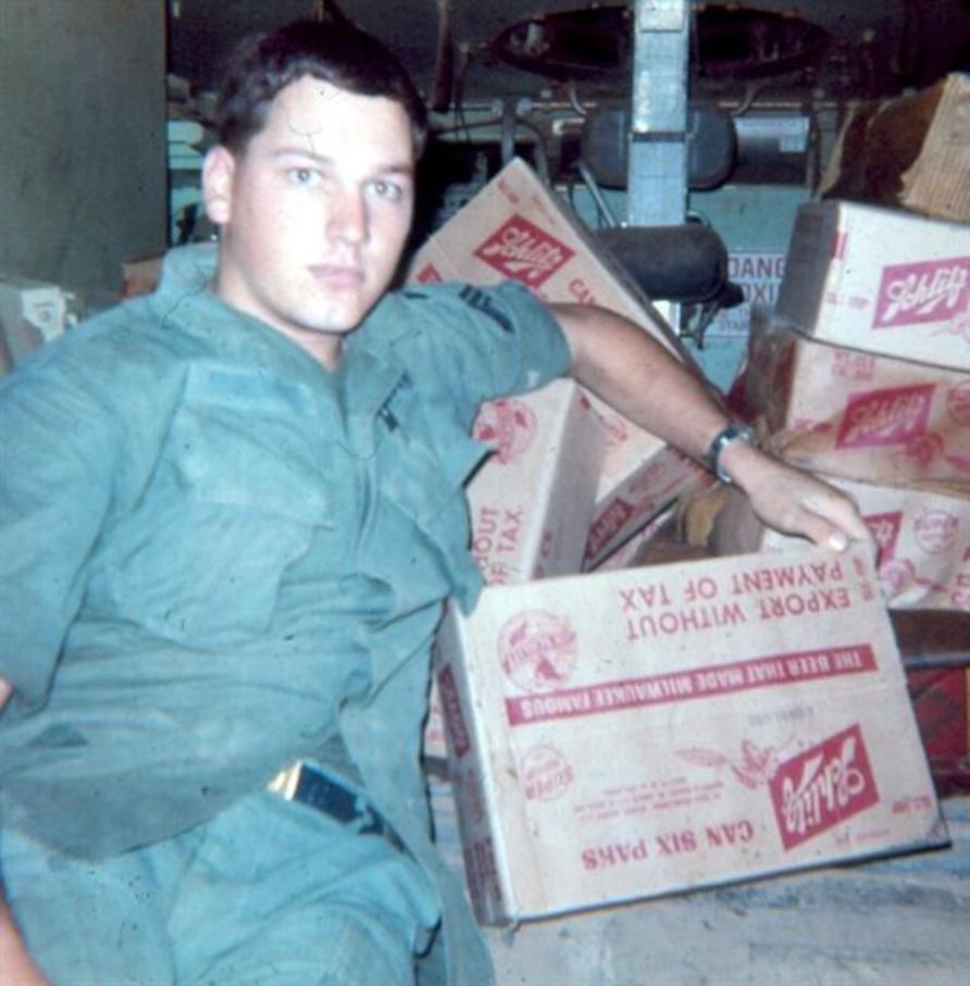 Sgt. Al Krabbenhoeft With The Rewards Of A Night Raid On A Pallet Of Beer     