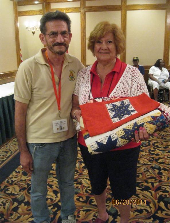 Rose Prado Has The Winning Bid On The Quilt - Photo courtesy of Tom & Rose LeMoine