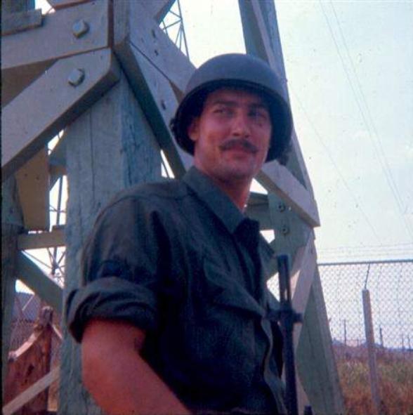 SP/4 Fred Parker Of St. Louis, MO Standing Next To Guard  Tower At Newport 