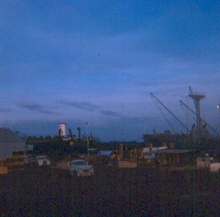Left - Looking Across The Saigon River From Docks - Right - An Evening Photo Of The Docks