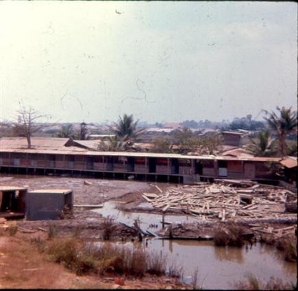 Left - The Orphanage Next To Newport Located Near Sea Land Just Outside The Newport Perimeter - Right -  Looks Like The New Mess Hall At Newport And One Of Our Orphan Friends Sitting In Jeep