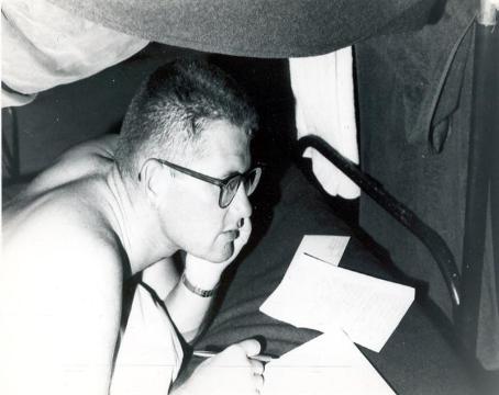 In my bunk writing home.  I still have all my letters I sent home to my ex-wife.  Note my Wally haircut and glasses.