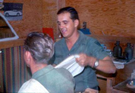 Left Photo - SP4 Ouellette (Our Barber) Getting Ready To Cut Another GI's Hair - Right Photo - Cats had a short life in Vietnam.