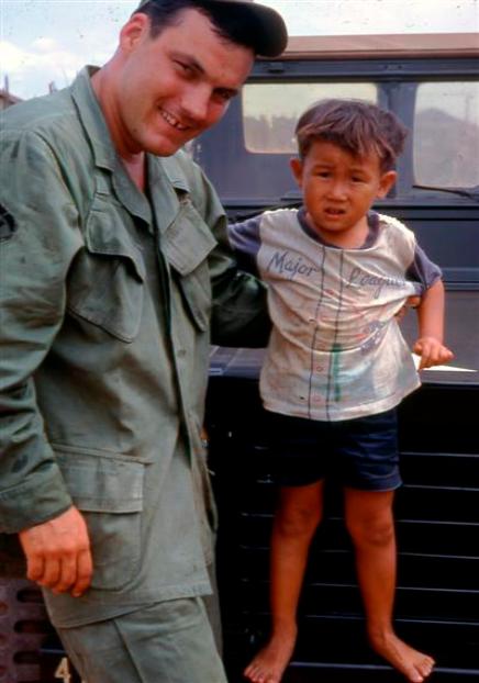 SP5  Don Beatty ( Chaplain Assistant ) With One Of The Younger Orphans 