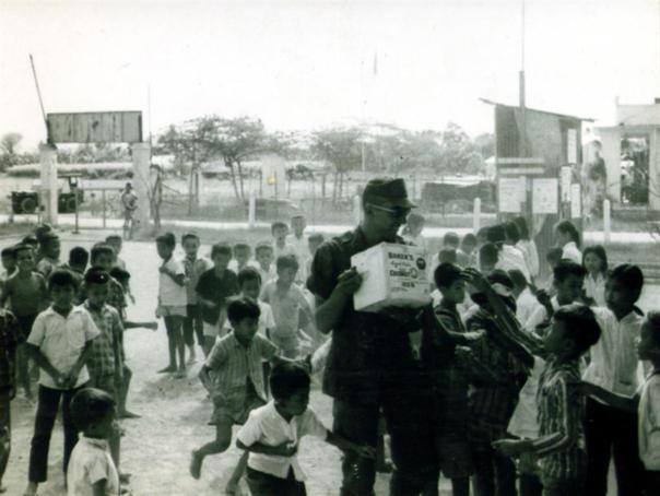 Lt Colucci Passing Out Candy To Children In Village Across From Camelot