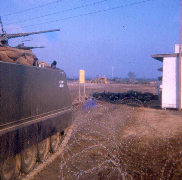 Front Gate - Another One Of Our APCs - Looks like some of the port security MPs behind those sandbags in front.